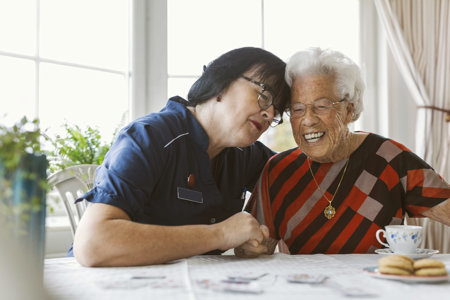 Nurse with an old lady smiling