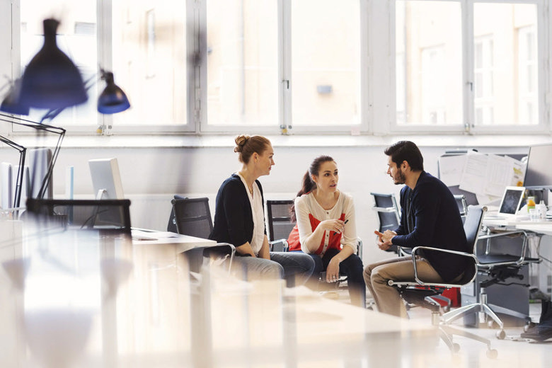 People sitting and talking in an office