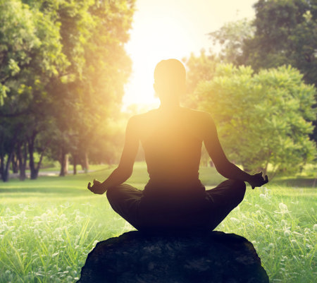 a-young-woman-with-adhd-meditates-on-the-grass-at-her-local-park