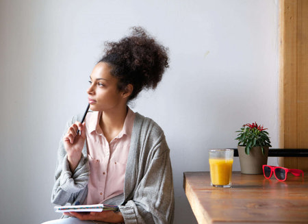 girl-sitting-in-a-room-thinking