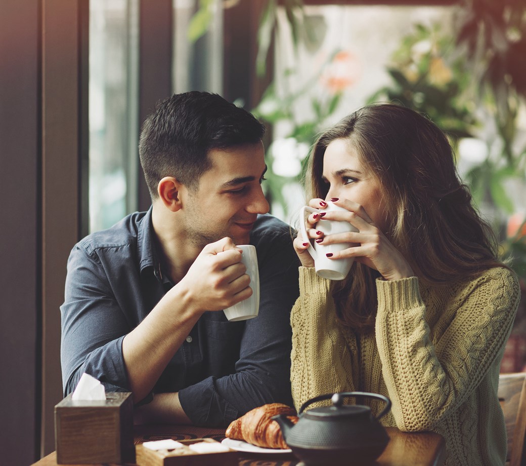 Couple drinking coffee in a coffee shop